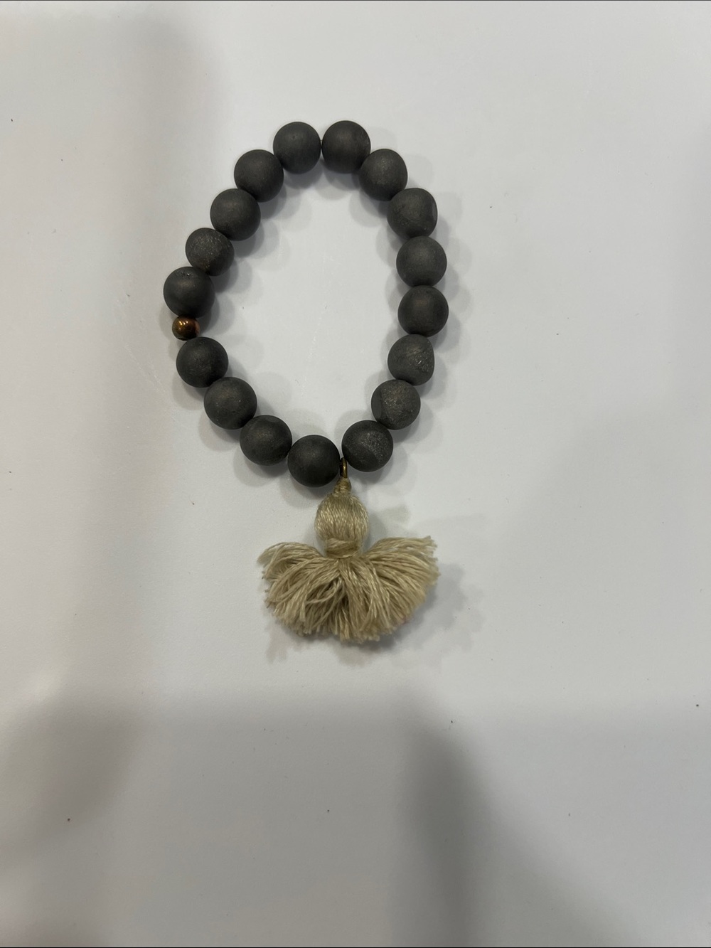 Matte Black Bead Bracelet with Cream Tassel